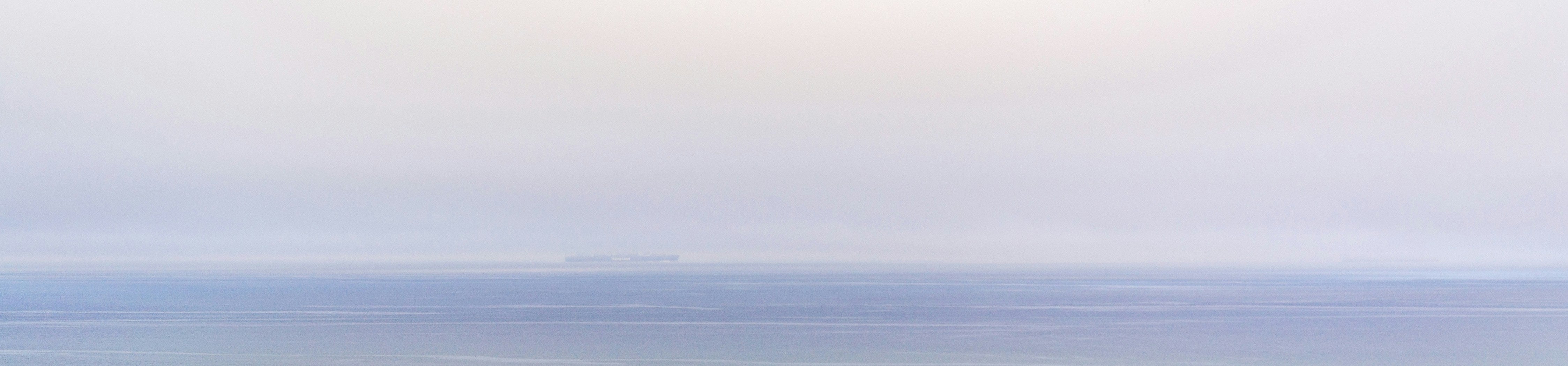 Gradient of blue and green colors from top to bottom on a plain background